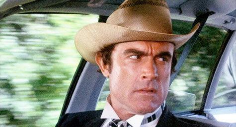 Mike Henry wearing a brown hat in a scene from the 1977 movie, Smokey and the Bandit