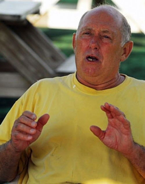 Mike Marshall (pitcher) doing hand gestures wearing a plain yellow shirt during an interview