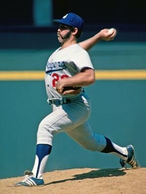 Pitcher Mike Marshall of the Los Angeles Dodgers pitches during a 1974 game against the Cincinnati Reds at Riverfront Stadium in Cincinnati, Ohio