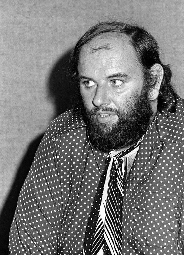 Peter Grant wearing polka dot long sleeves and neck tie