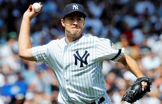 Mike Mussina Mussina can39t choose between a Yankees or an O39s cap for