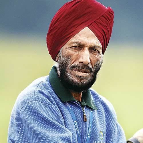 Milkha Singh wearing red turban & sports shirt