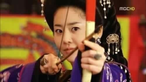 Go Hyun-jung as Lady Mishil playing archery in a scene from the 2009 historical drama Queen Seondeok