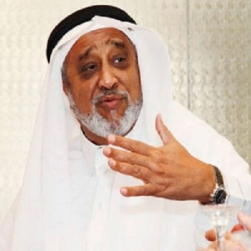 Mohammed Hussein Al Amoudi wearing a white dress, white ghutra and agal