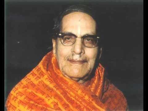 Mohanananda Brahmachari smiling while wearing eyeglasses and orange robe
