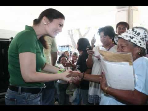Monica Prieto-Teodoro shaking hands with old lady during campaign