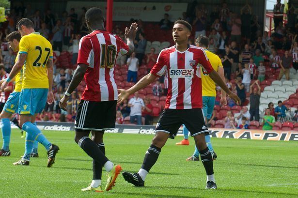 Montell Moore Brentford FC striker charged with handling stolen goods