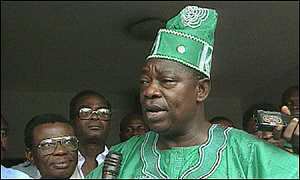 Moshood Abiola's in one of his interviews wearing his green and white Nigerian outfit