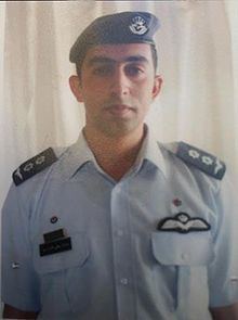 Muath Al-Kasasbeh wearing an air force pilot uniform