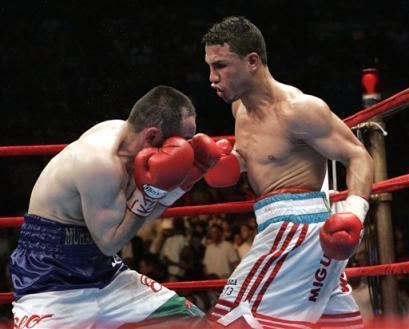 Muhammad Abdullaev Photos Miguel Cotto right of Puerto Rico hits Muhammad