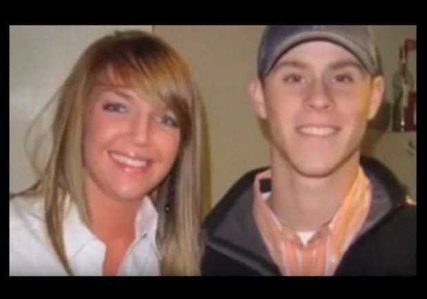 Channon Christian and Christopher Newsom are smiling while Channon with blonde straight hair is wearing a white blouse and Christopher is wearing a gray cap and white shirt under an orange polo and black jacket