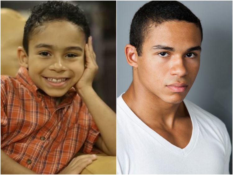 On the left, young Noah Gray-Cabey smiling and wearing orange and brown checkered polo while on the right, he is wearing a white t-shirt