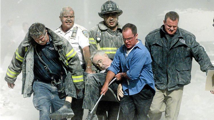 Rescue workers carrying the body of Mychal Judge from the wreckage of the World Trade Center in New York City