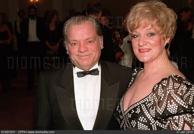 Myfanwy Talog smiled while wearing black and white dress with sequins and David Jason wearing black coat, white long sleeves and bow tie