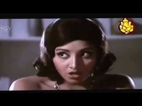 K. Vijaya as Kamini with short hair and an open mouth in a movie scene from Naa Ninna Bidalaare, a 1979 Indian Kannada-language horror film.