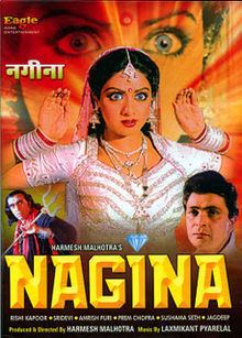 Amrish Puri holding a trident, Amrish Puri wearing white long sleeves, and Sridevi wearing a white gown in the movie poster of the 1986 film Nagina