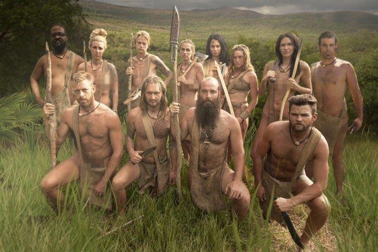 Men and women participants of the reality series "Naked and Afraid"  holding large knives and wooden sticks while posing in the mountains