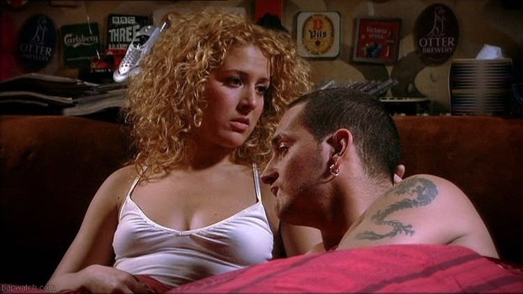 Natalie Casey (left) and Will Mellor (right) in a bed scene from Two Pints of Lager and a Packet of Crisps (2001 sitcom).