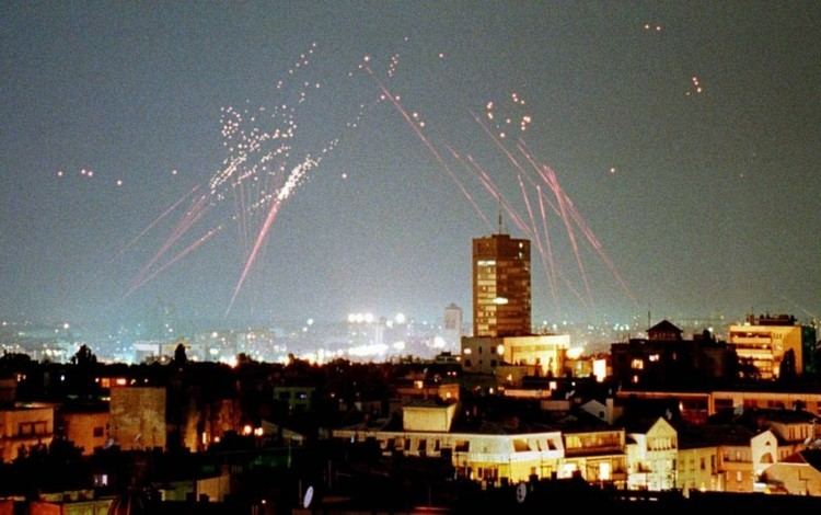Tracer fire from air defenses lights up the sky over Belgrade early on April 30, 1999.