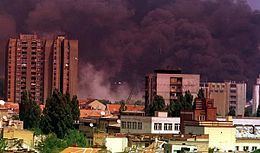 The city of Novi Sad, Serbia covered with dark smoke after the NATO bombardment.