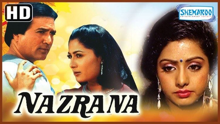 The movie poster of Nazrana (1987 film) with Rajesh Khanna, and Sridevi, with the scene of Smita Patil on the left