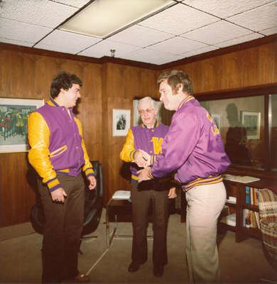 Neale Tayler Neale Tayler receiving Lettermens Club jacket Laurier Library Images
