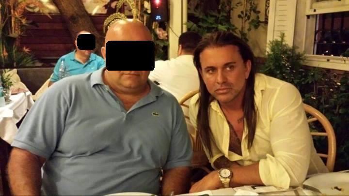 Necati Arabaci in a restaurant with a bald man