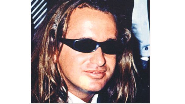 Necati Arabaci in long hair  and wearing shades