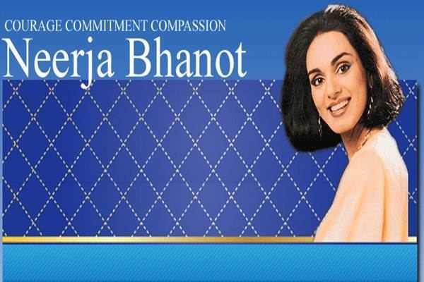 On the left, is a caption Courage Commitment Compassion while on the right, Neerja Bhanot with a big smile and black short hair and wearing a peach blouse and earrings
