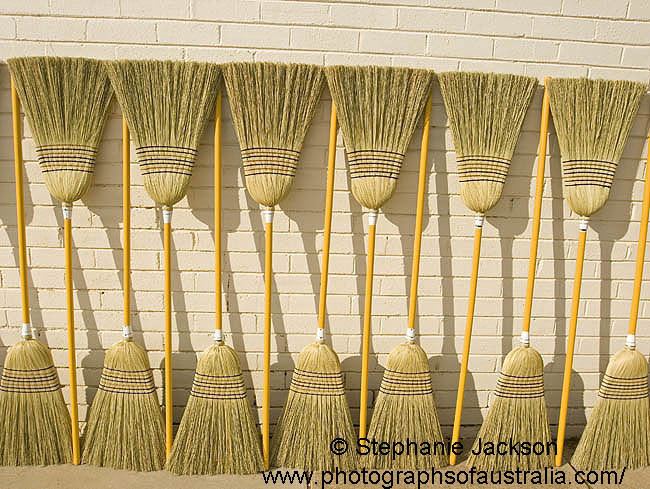 New Brooms Row of New Brooms Stock Photos