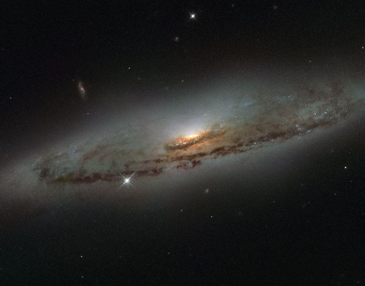 NGC 4845 scitechdailycomimagesHubbleViewsSpiralGalaxy
