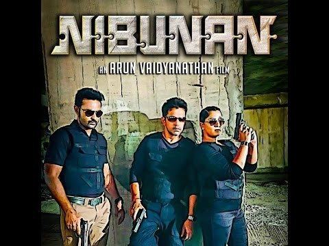 Nibunan Nibunan Movie Trailer Action King Arjun Varalakshmi Sarathkumar