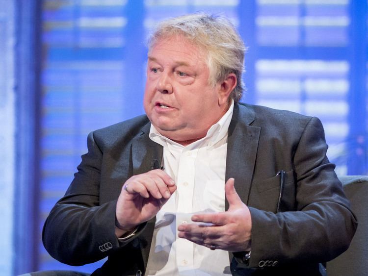 Nick Ferrari while doing hand gestures during his presentation