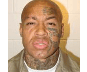 Nikko Jenkins in a brown shirt