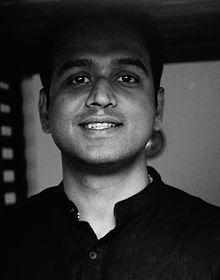 Nithin Kamath with a smiling face, wearing a black shirt.