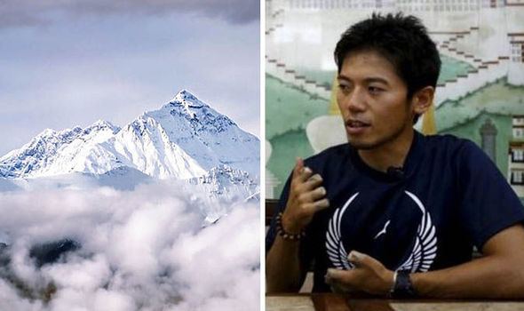 Nobukazu Kuriki Japanese climber with one finger is almost at summit of