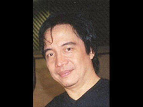 Nonoy Zuniga smiling closed mouth and wearing a black shirt.