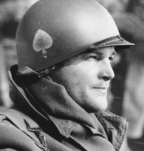 Norman Dike, a Lieutenant and former commander of Easy Compan, wearing jacket and a cap