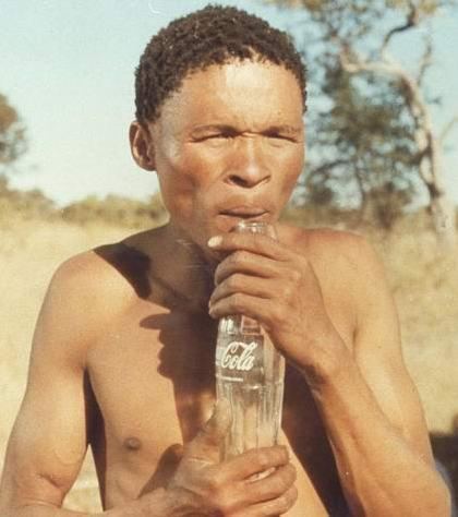 Movie Scene of Nǃxau ǂToma as Xi holding a coca-cola bottle from The Gods Must Be Crazy (1980)