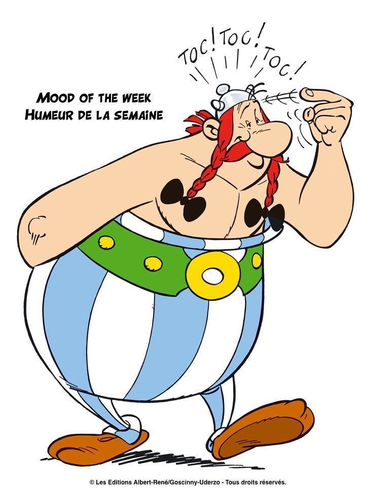 Obelix smiling while pointing his finger to his head