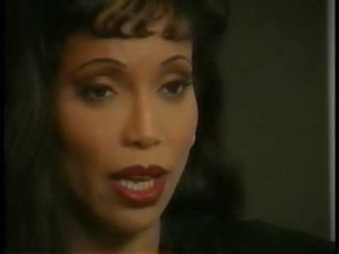In an interview, Octavia St. Laurent is serious, her mouth half opened, and has black hair with bangs.