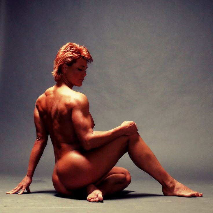 Olga Kurkulina sitting on the floor without clothes