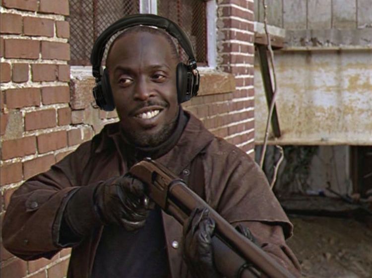 Omar Little s portrayed by Michael K Williams smiling and holding a shotgun in a scene from the HBO TV series The Wire, 2002.