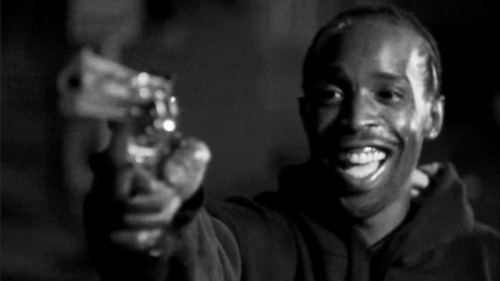 Omar Little s portrayed by Michael K Williams smiling and holding a pistol in a scene from the HBO TV series The Wire, 2002.