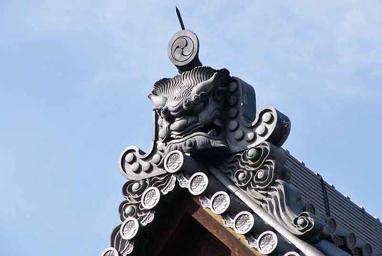 Onigawara Onigawara or a gargoyle on the roof of Hojo Kinkakuji in Kyoto Japan
