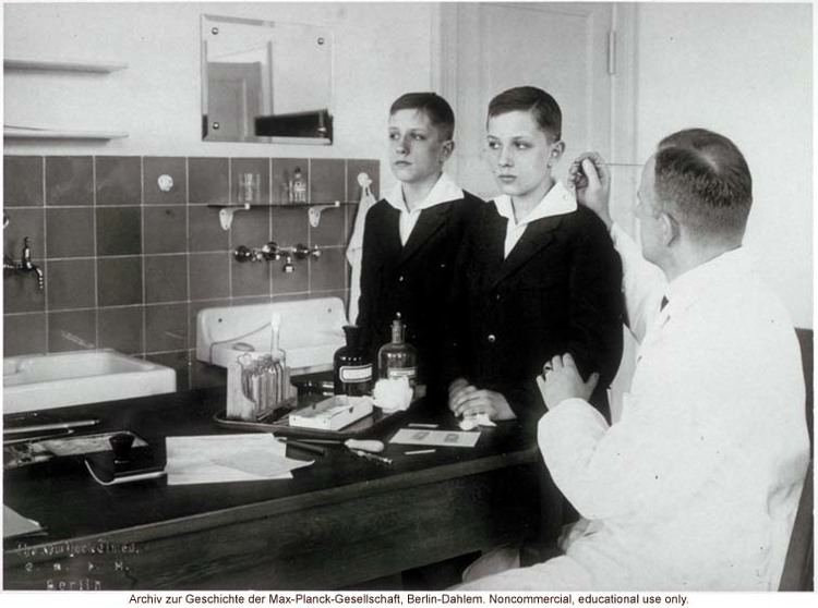 Otmar Freiherr von Verschuer 12yearold male twins undergoing anthropometric study by Otmar
