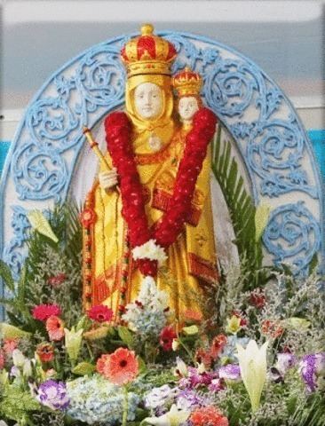The golden statue of Our Lady of Good Health during thanksgiving and flowers were placed around the statue