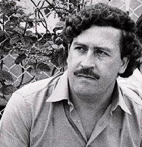 Pablo Emilio Escobar Gaviria with a mustache and curly hair.