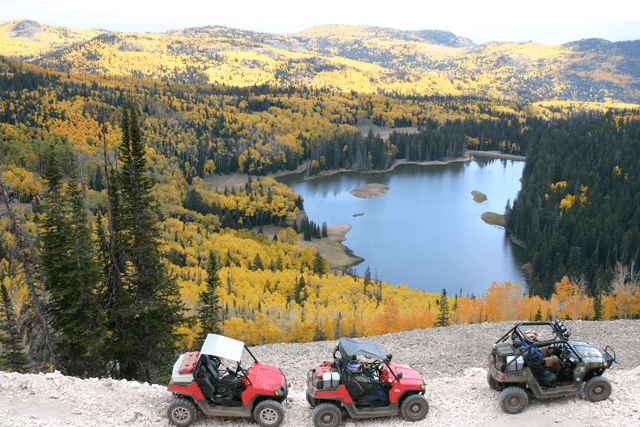 People taking a trail along the Paiute Trail on their Utility Terrain Vehicles