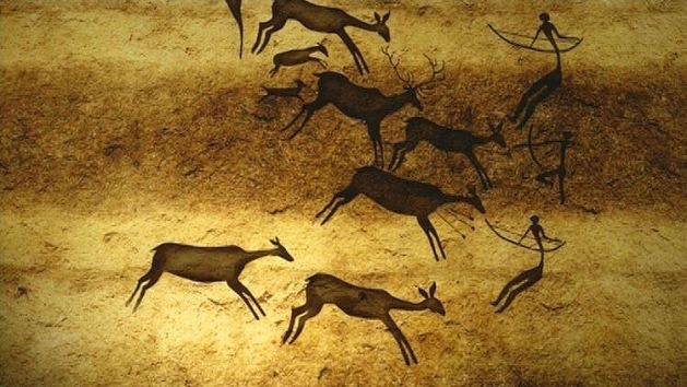 Artwork in the Paleolithic era showing how people hunt for their food
